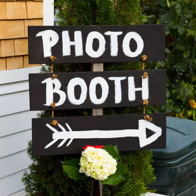a sign with a flower and a plant